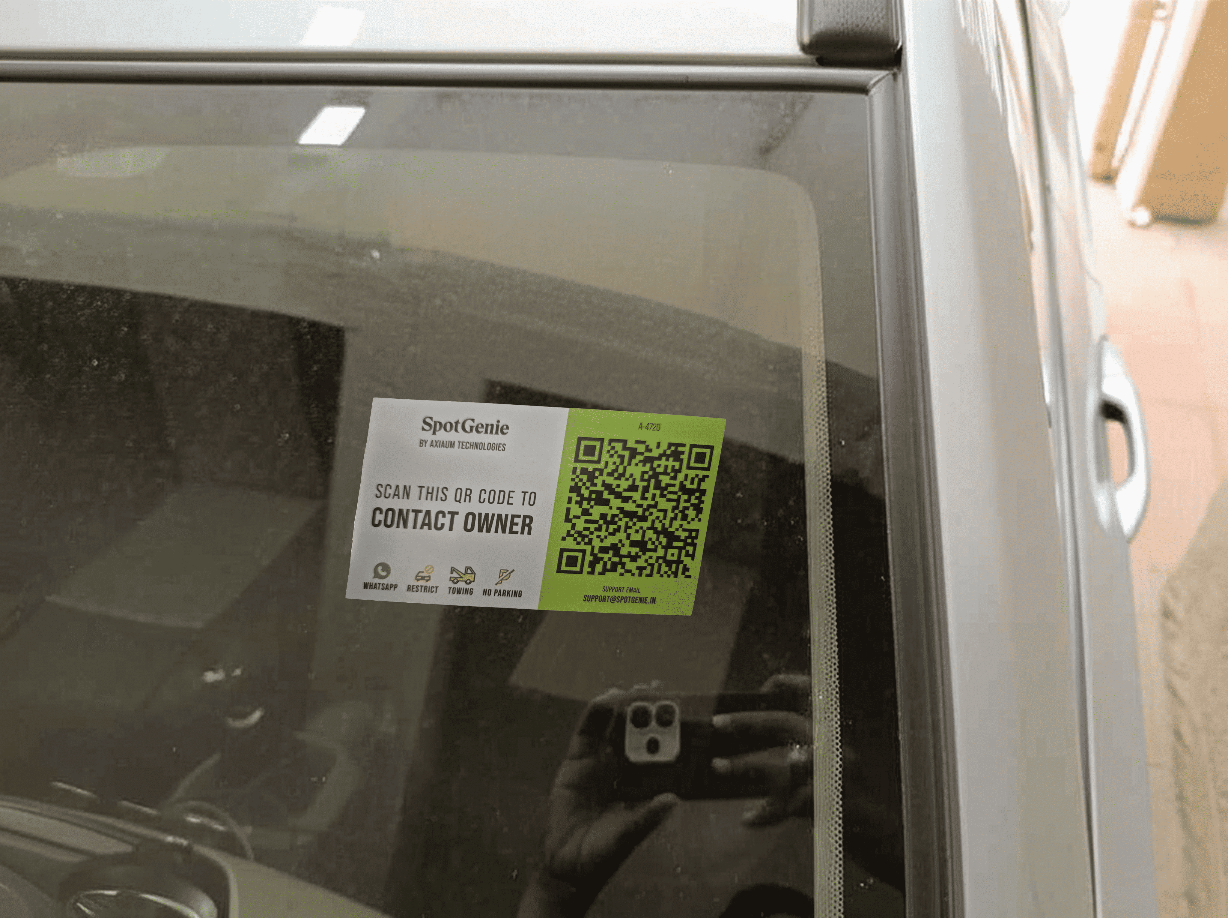 SpotGenie QR code sticker on car windshield